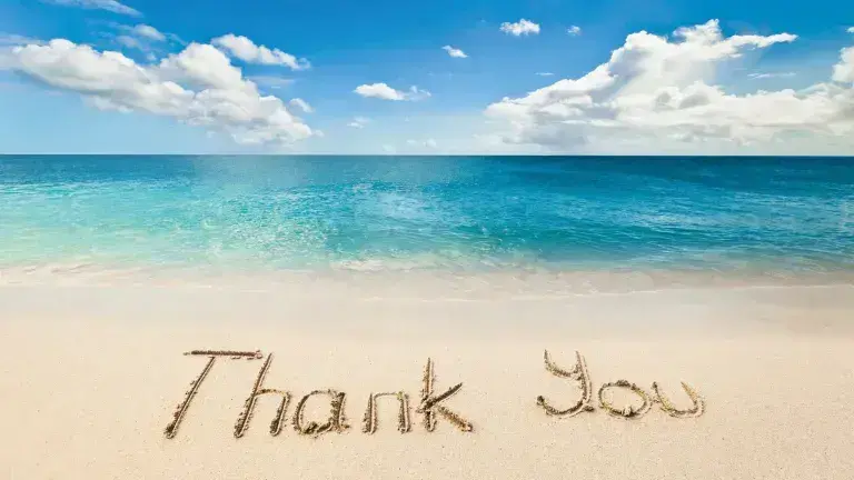 Thank You im Sand geschrieben